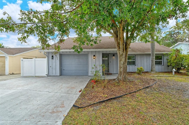 ranch-style home featuring a garage