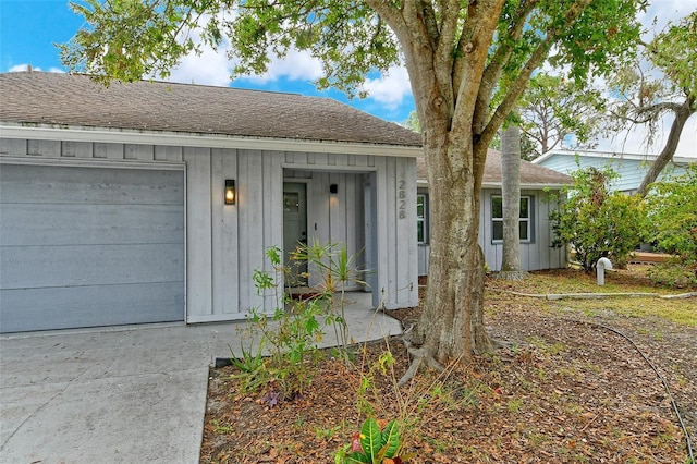 view of exterior entry featuring a garage