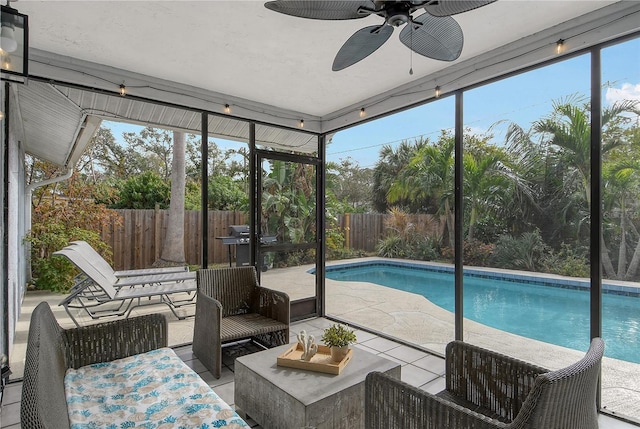 sunroom with ceiling fan and a wealth of natural light