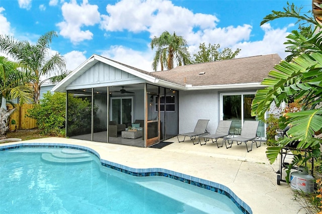 back of property featuring ceiling fan, a patio area, and a sunroom