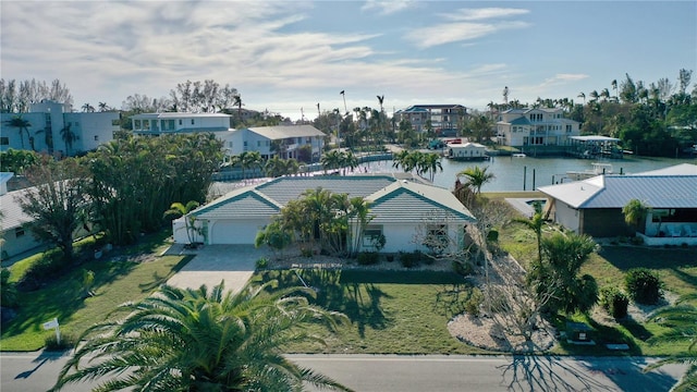 birds eye view of property featuring a water view