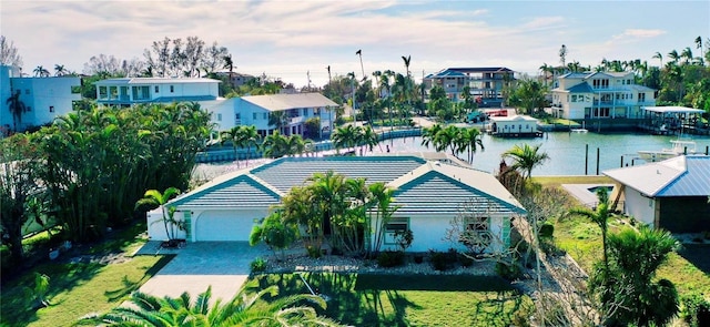 aerial view with a residential view and a water view