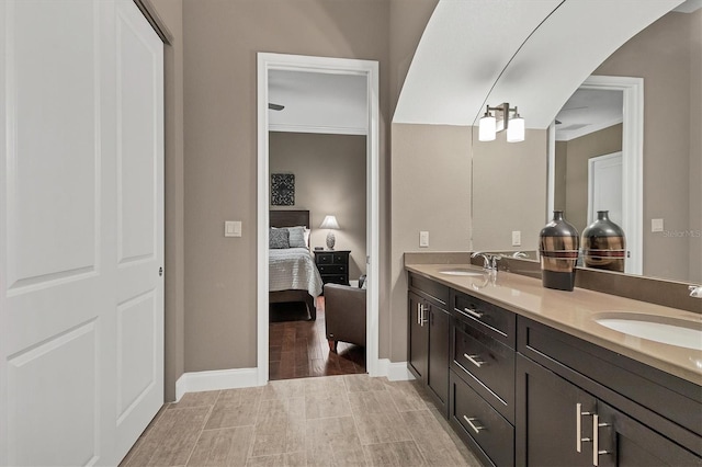 bathroom featuring vanity and ornamental molding