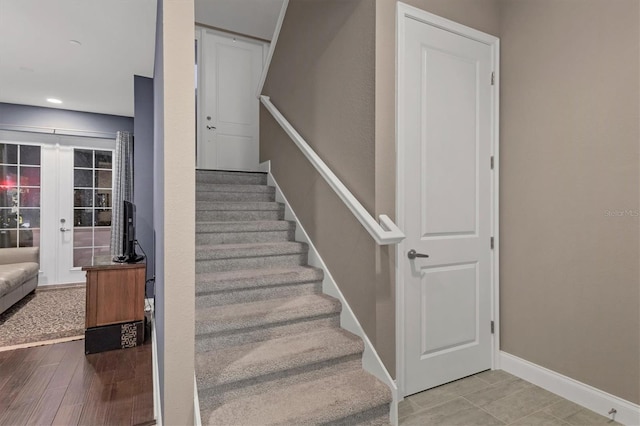 stairway featuring french doors