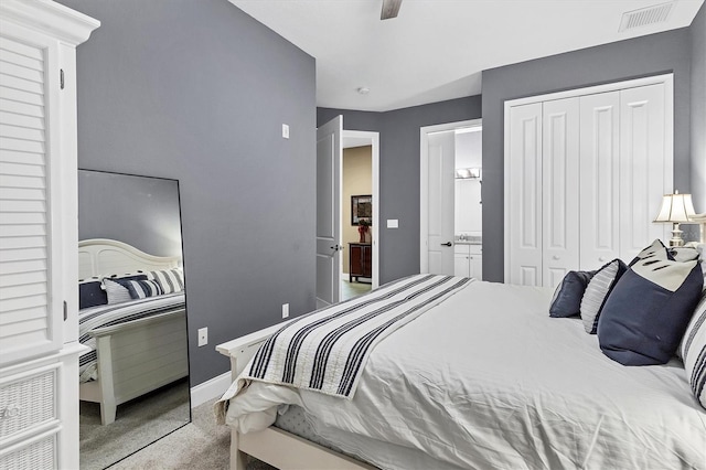 carpeted bedroom featuring a closet and ceiling fan