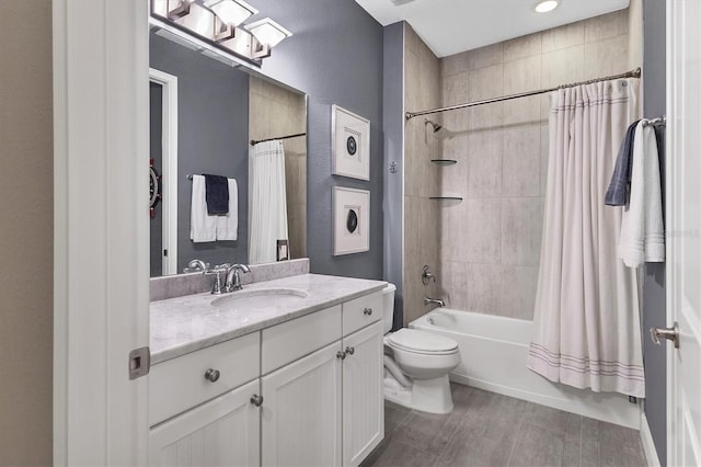 full bathroom featuring shower / bath combo, toilet, and vanity