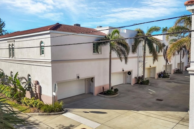 view of side of property featuring a garage