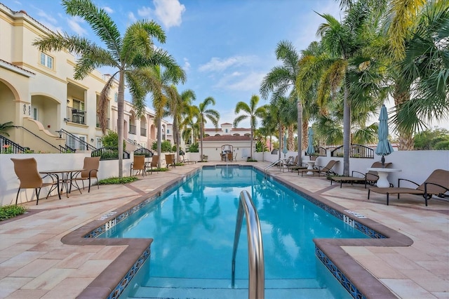 view of swimming pool with a patio area