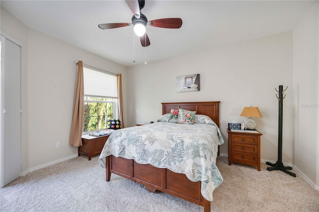 bedroom featuring light colored carpet and ceiling fan