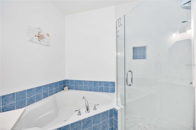 bathroom with separate shower and tub