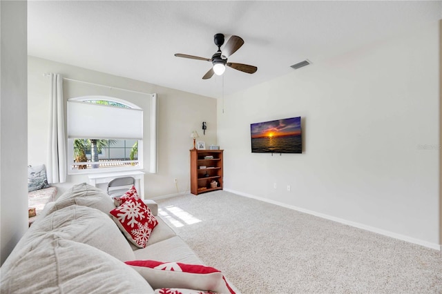 living room featuring carpet and ceiling fan