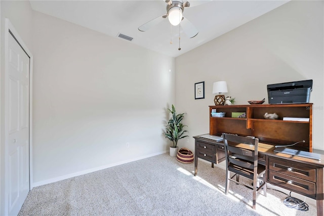 office space with light carpet and ceiling fan