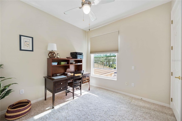 carpeted home office with ceiling fan