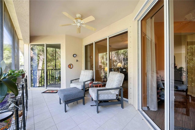 sunroom / solarium with ceiling fan