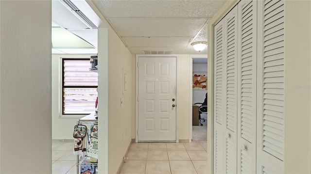 hallway with light tile patterned floors