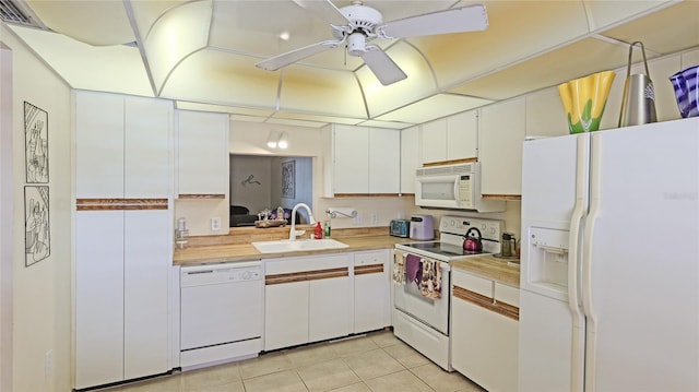 kitchen featuring white cabinetry, sink, ceiling fan, white appliances, and light tile patterned flooring