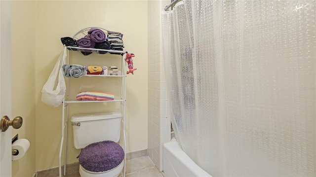 bathroom with tile patterned floors, shower / bath combination with curtain, and toilet