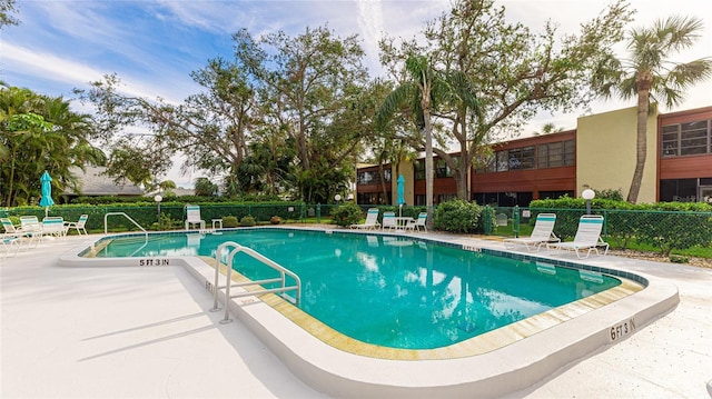 view of swimming pool with a patio