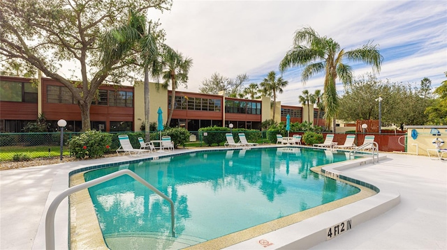 view of swimming pool featuring a patio area