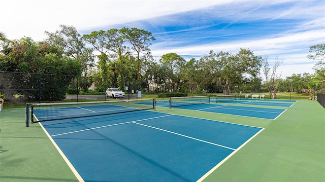 view of tennis court featuring basketball court