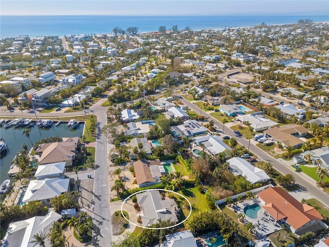 bird's eye view with a water view