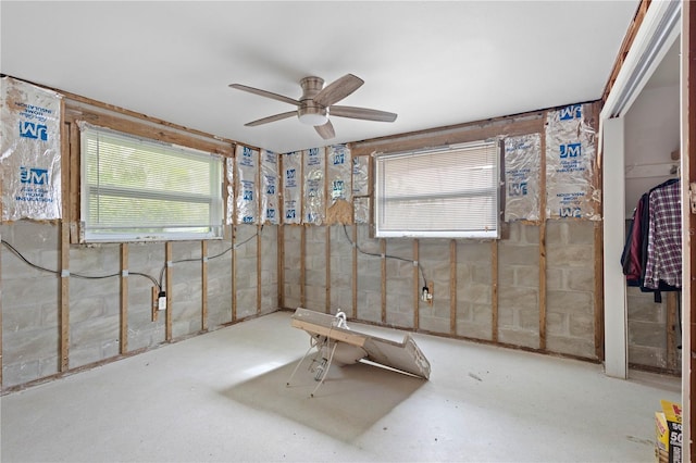 interior space featuring ceiling fan and a healthy amount of sunlight