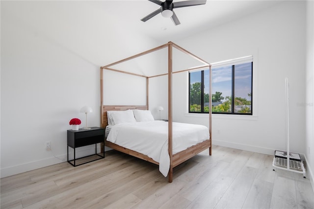 bedroom with light hardwood / wood-style floors and ceiling fan