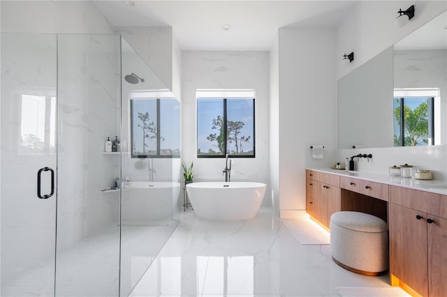 bathroom with vanity and separate shower and tub