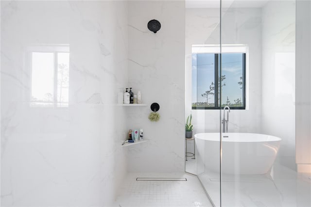 bathroom with separate shower and tub