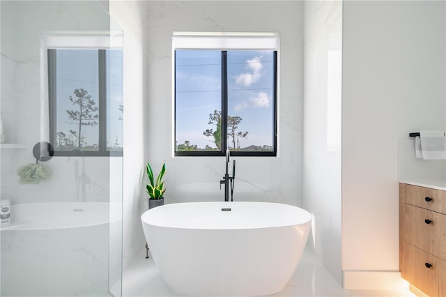 bathroom featuring vanity and a bathing tub