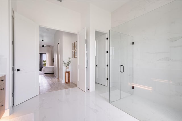 bathroom with a shower with shower door