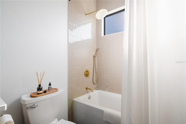 bathroom featuring shower / bathtub combination with curtain and toilet