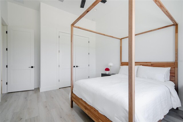 bedroom featuring a closet and light hardwood / wood-style flooring