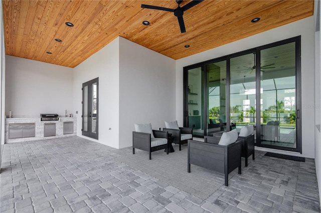 view of patio / terrace with area for grilling, french doors, and ceiling fan