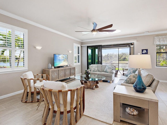 living room with ceiling fan, crown molding, and a wealth of natural light