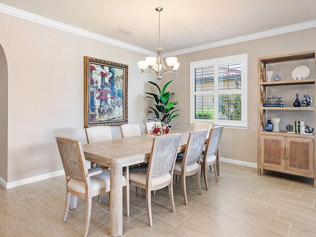 dining space featuring a chandelier and ornamental molding