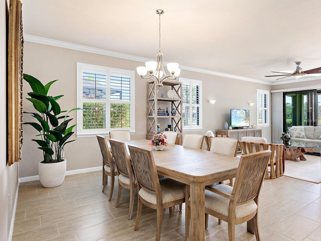 dining room featuring ceiling fan with notable chandelier and ornamental molding