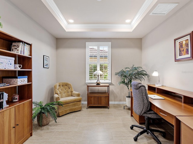 home office with a tray ceiling and crown molding