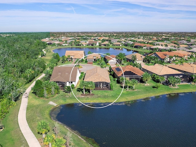 birds eye view of property with a water view