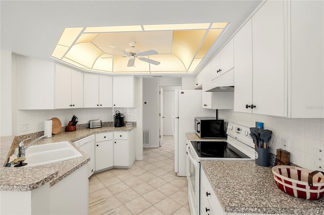 kitchen featuring custom exhaust hood, white appliances, sink, ceiling fan, and white cabinetry