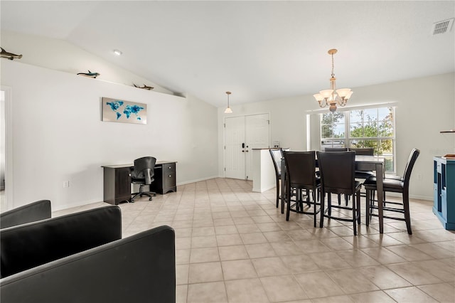 dining space featuring vaulted ceiling and an inviting chandelier