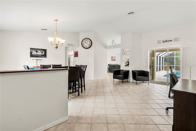 interior space featuring a chandelier and vaulted ceiling