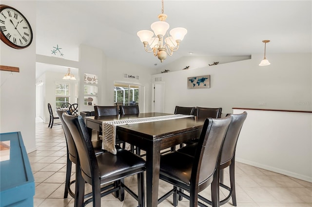 dining room with light tile patterned floors, vaulted ceiling, and an inviting chandelier