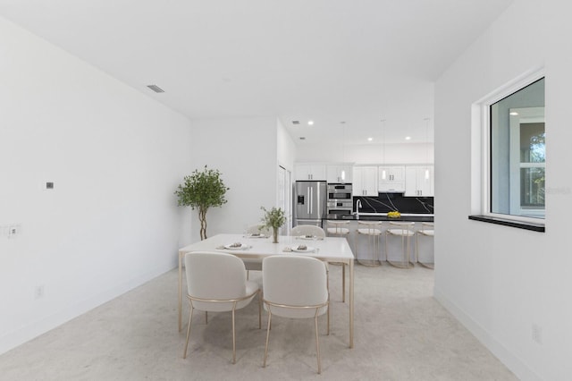 dining space featuring sink