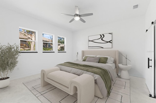 bedroom with ceiling fan and light carpet