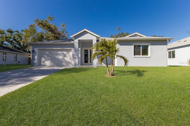 ranch-style home featuring a garage and a front yard