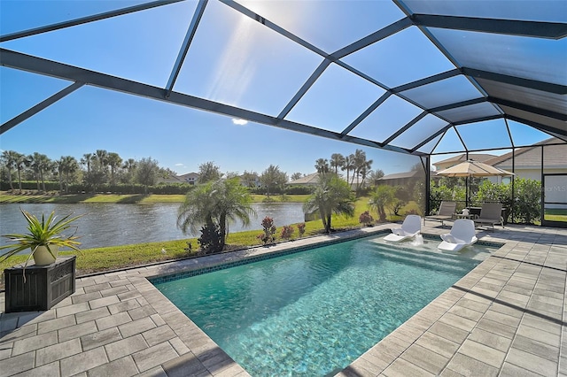 pool with a water view, a patio area, and glass enclosure