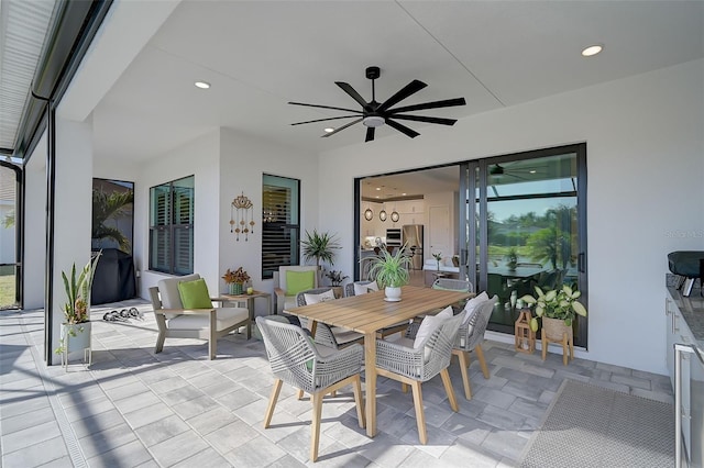 view of patio featuring ceiling fan