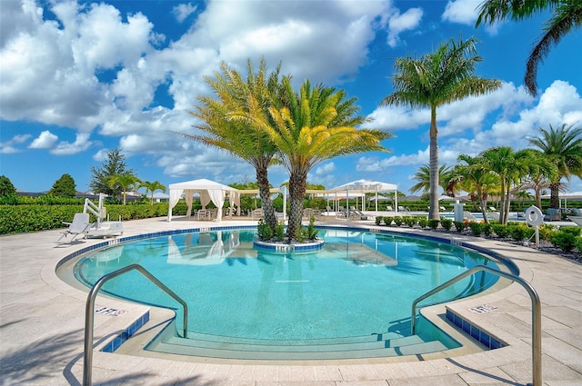 view of swimming pool with a gazebo and a patio area