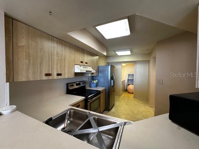 kitchen featuring sink and appliances with stainless steel finishes